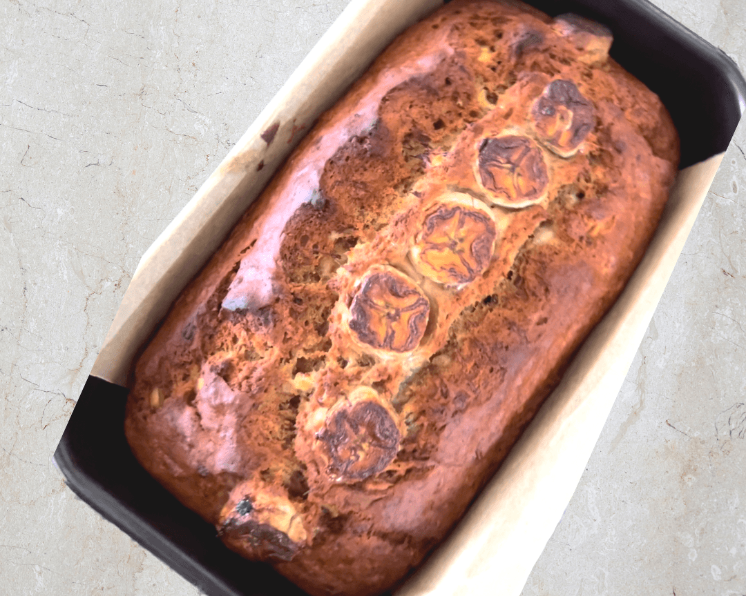 Homemade banana bread loaf with banana slices