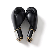 Black leather boxing gloves with gold trim