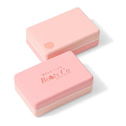 Set of pink Brazilian Booty Co yoga blocks with logo.